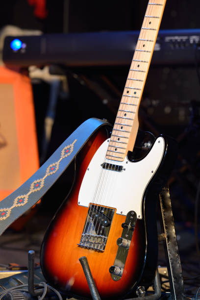 istock Guitar and other musical equipment on stage before concert 912628298