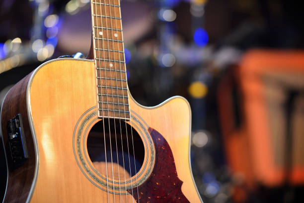 istock Guitar and other musical equipment on stage before concert 912628304