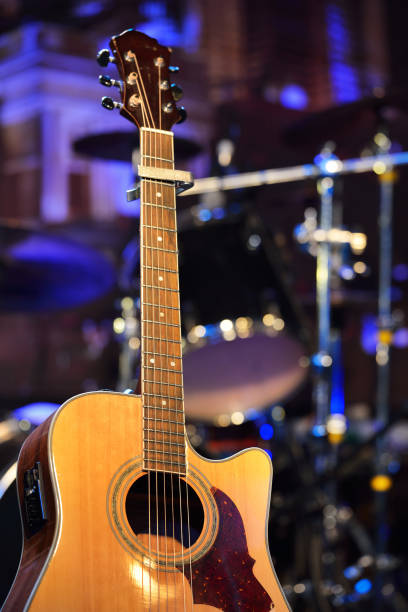 istock Guitar and other musical equipment on stage before concert 912628308