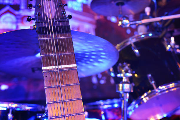 istock Guitar and other musical equipment on stage before concert 912628378