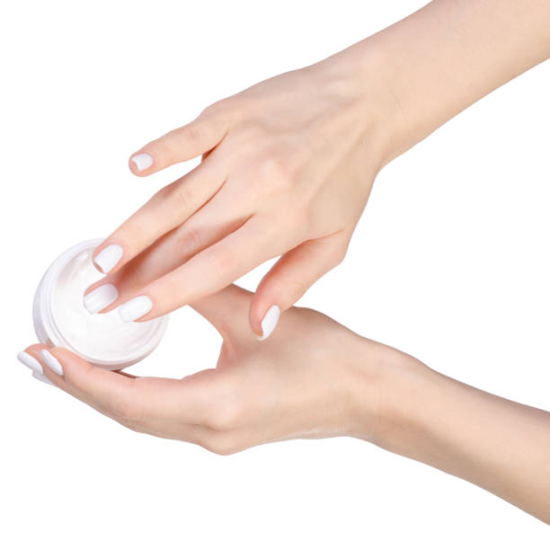 istock Cream on female hands 912629988