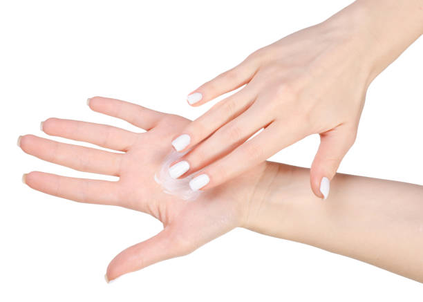 istock Cream on female hands 912630060