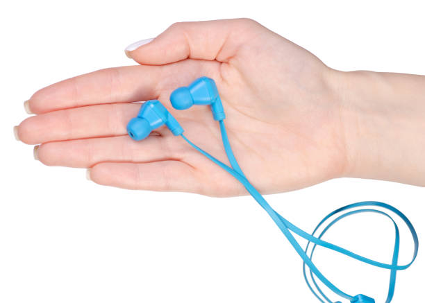 istock Blue headphones in hands 912632672