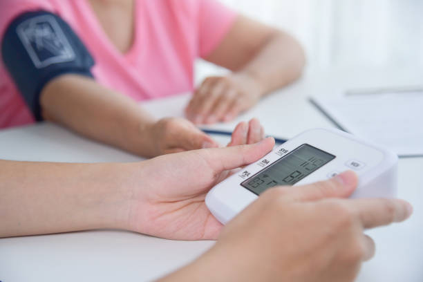 istock Female doctor measuring blood pressure. 912641274