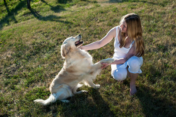 istock Woman Playing with her Dog 912644548