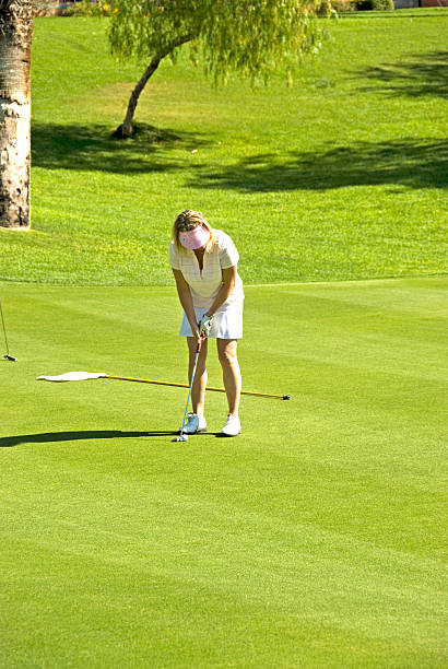 istock Lady Golfer on the Putting Green 91264581