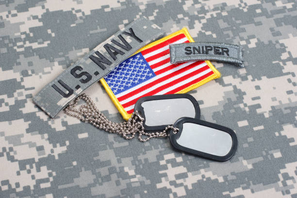 istock US NAVY sniper tab with blank dog tags on camouflage uniform 912648838