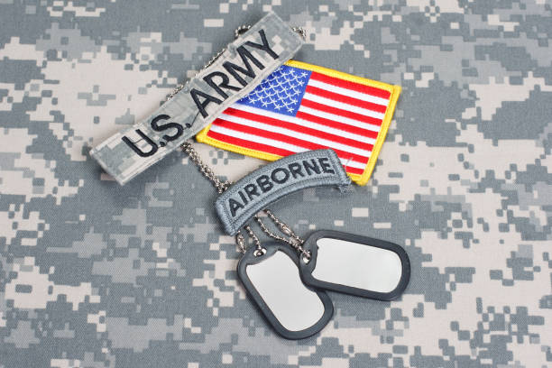 istock US ARMY airborne tab with blank dog tags on camouflage uniform 912649246