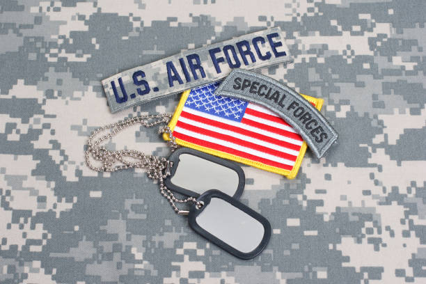 istock US AIR FORCE special forces tab with blank dog tags on camouflage uniform 912649760