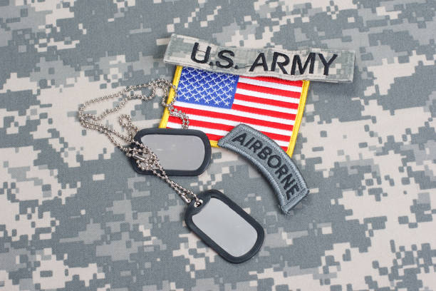 istock US ARMY airborne tab with blank dog tags on camouflage uniform 912650268