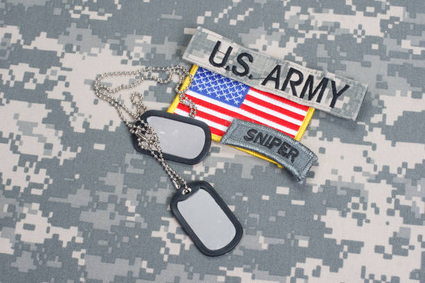 istock US ARMY sniper tab with blank dog tags on camouflage uniform 912650376