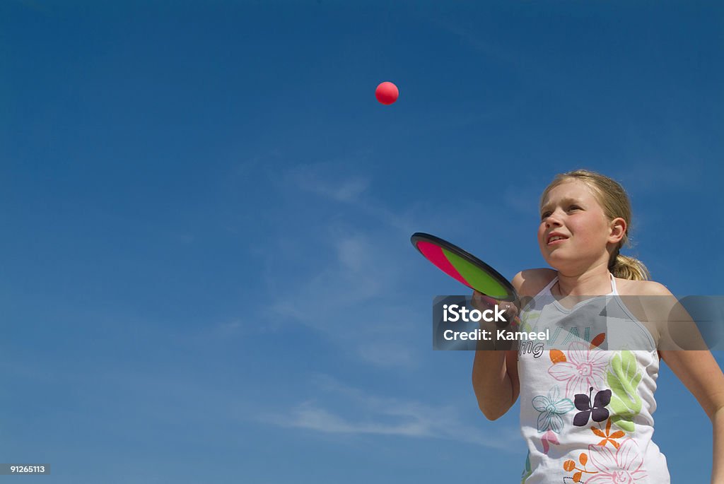 girl playing a ball game at the beach  Active Lifestyle Stock Photo