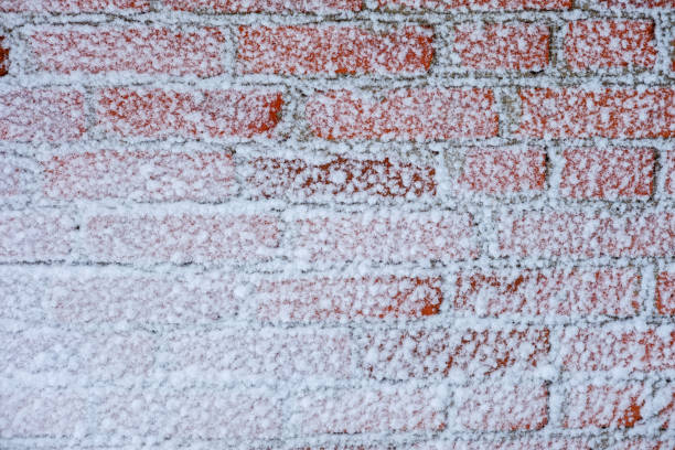 istock snow wall of red brick.background 912656410