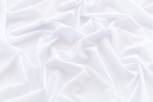 istock White fabric background and texture, Crumpled of white satin for abstract and design 912657112