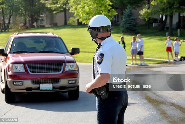 Policeman Directing Traffic Stock Photo - Download Image Now - Driveway, Police Force, Community