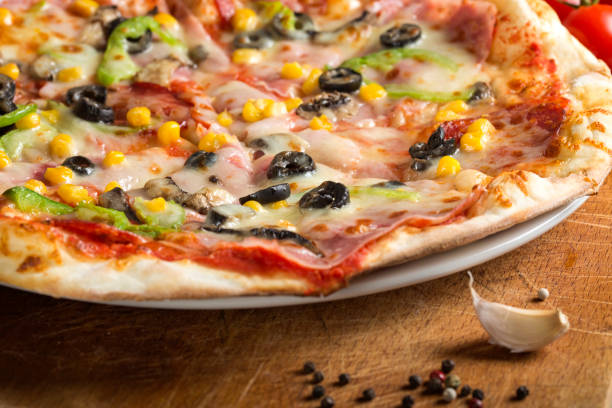 istock Italian Capriciosa pizza made with salami and vegetables 912663534