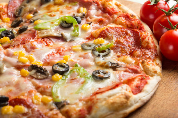 istock Italian Capriciosa pizza made with salami and vegetables 912663562