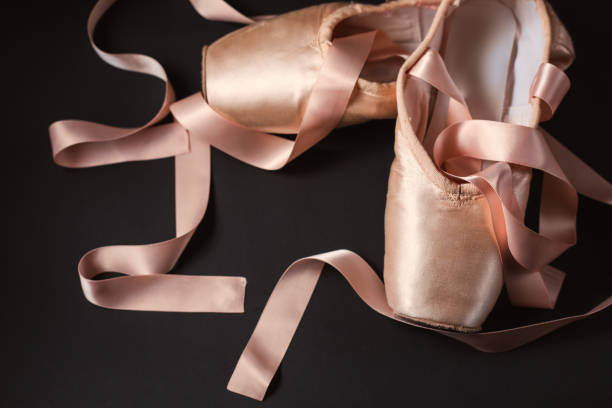 istock ballet shoes on a black background 912663836