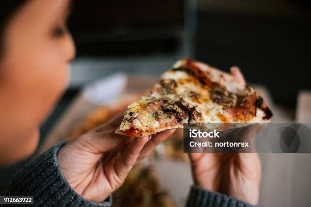 Eating Pizza At Night Closeup Stock Photo - Download Image Now - Eating, Pizza, Night