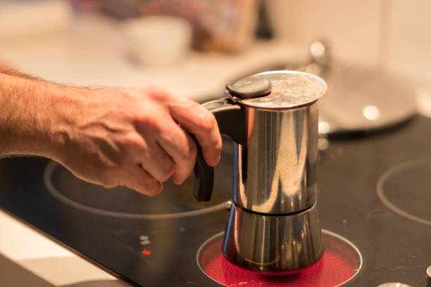 istock Male hand holding a coffee pot 912663992