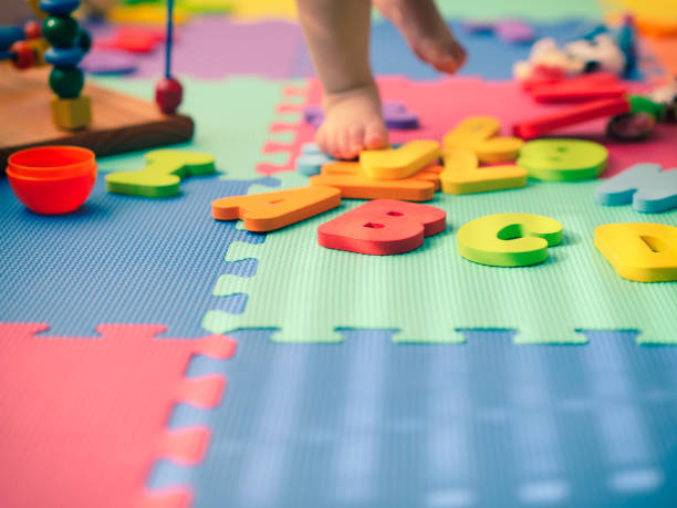 istock Low Section Of Baby Playing With Toy 912665140
