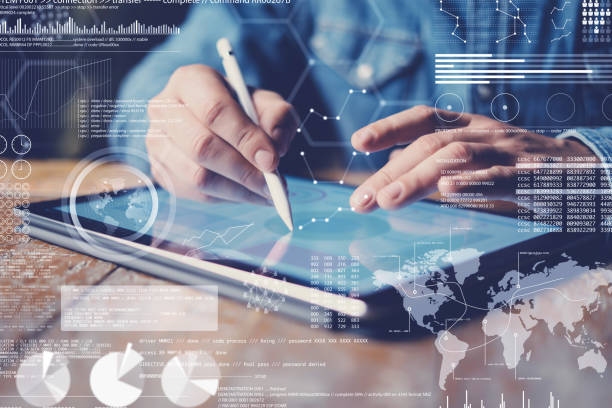 istock Concept of virtual diagram,graph interfaces,digital display,connections icon.Male hand holding stylus pencil on display of contemporary electronic tablet.Blurred background. Horizontal. 912665922