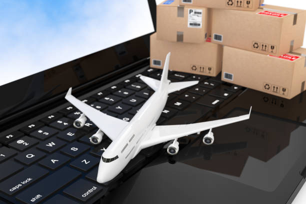 istock White Jet Passenger's Airplane with Cardboard Boxes over Modern Laptop Computer Keyboard. 3d Rendering 912666046
