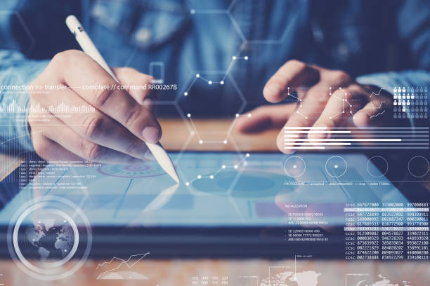 istock Concept of virtual diagram,graph interfaces,digital display,connections icon.Man using stylus pencil on display of contemporary electronic tablet.Blurred background. Horizontal. 912673878