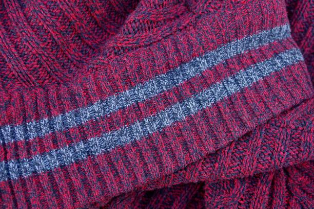 istock Red fabric texture with gray stripes on the collar 912683166