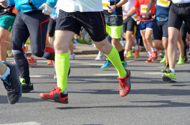 istock Marathon running race, many runners feet on road 912687768