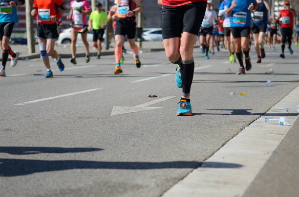 istock Marathon running race, many runners feet on road 912687774