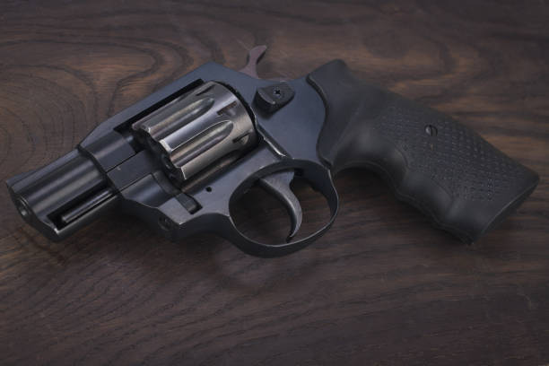 istock Revolver on the wooden table 912688064