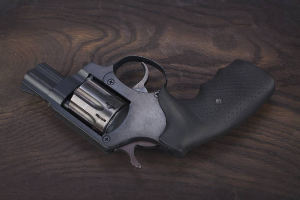 istock Revolver on the wooden table 912688706