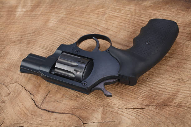 istock Revolver on the wooden table 912689236