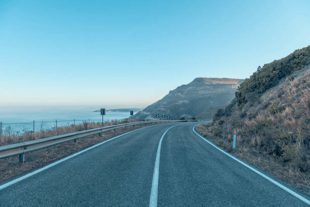 istock Road by the sea with blue sky in clear day. 912689450