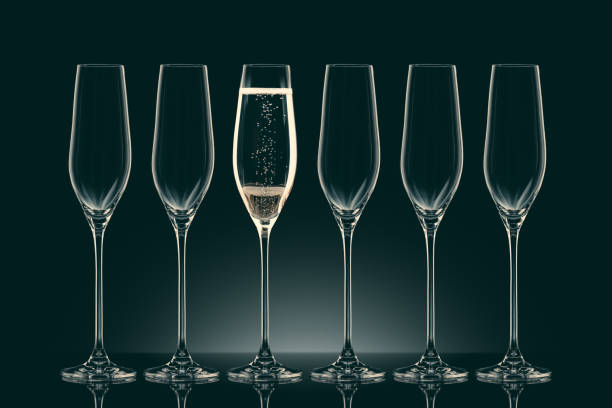 istock five empty glasses and one glass with champagne on black 912689856