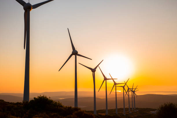 istock Renewable energy with wind turbines 912689894
