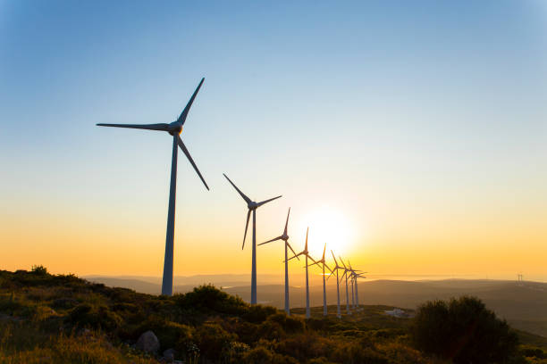 istock Renewable energy with wind turbines 912696808