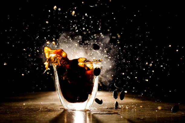 istock Splashes of coffee from hot mug located on the table 912700014
