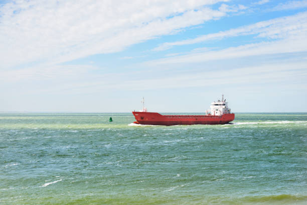 istock Red cargo ship (bulk carrier) sailing in Baltic sea 912700486