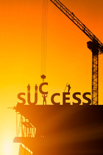 Shadow of the success of the construction worker, the concept of success of the work is tired than to accomplish it, which has been difficult. stock photo