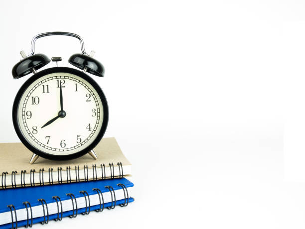 istock Back to school concept with Alarm clock and book 912705218