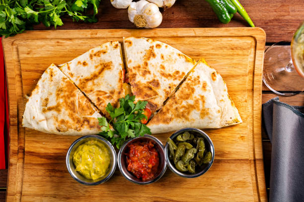 Quesadilla with sauces stock photo