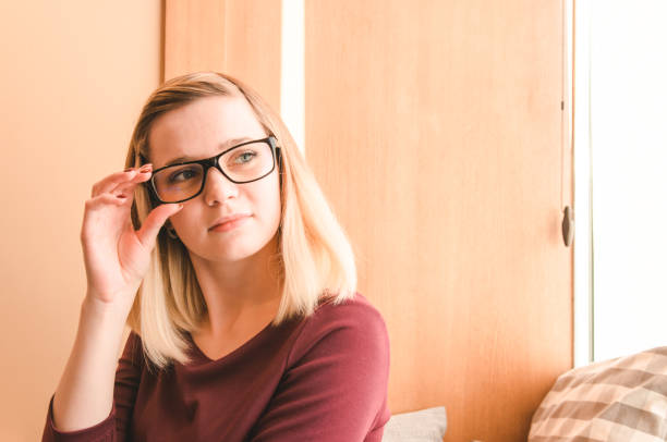 istock Relaxed young woman in eyeglasses 912717352