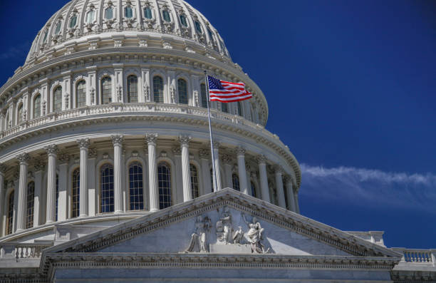 istock U.S. Capitol Building Dome and American Flag in Washington, DC 912723410