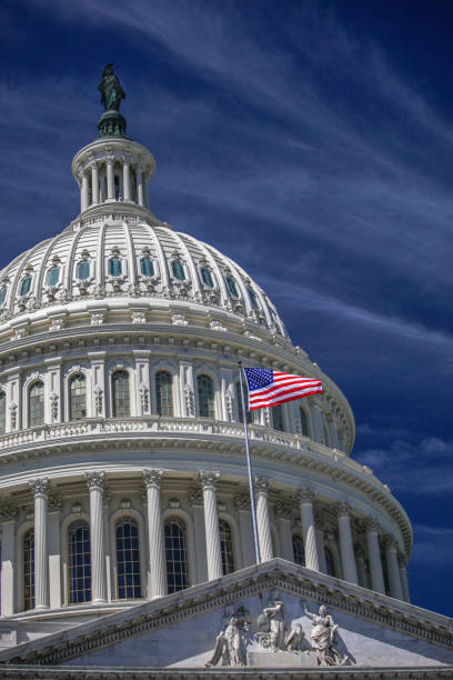istock U.S. Capitol Building Dome and American Flag in Washington, DC 912723414