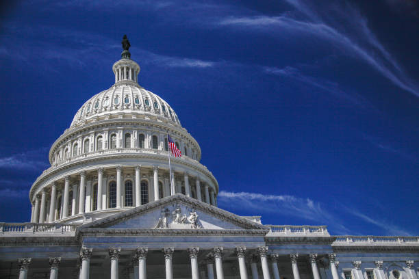 istock U.S. Capitol Building Dome and American Flag in Washington, DC 912723416