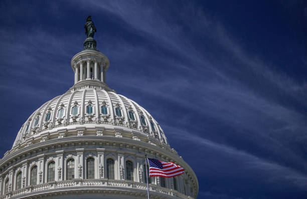 U.S. Capitol Building Dome and American Flag in Washington, DC United States Capitol Building Dome and American Flag - Washington DC senator photos stock pictures, royalty-free photos & images