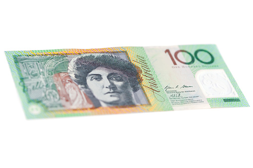 Angled Australian one hundred dollar bill on white background.
