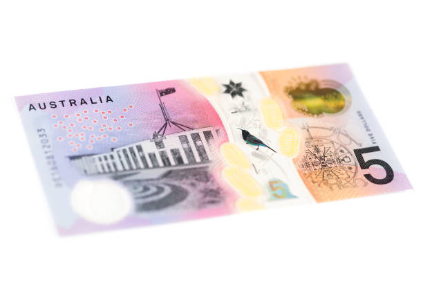 Five Australian Dollar Bill - Back Angled Australian five dollar bill on white background. five dollar bill stock pictures, royalty-free photos & images